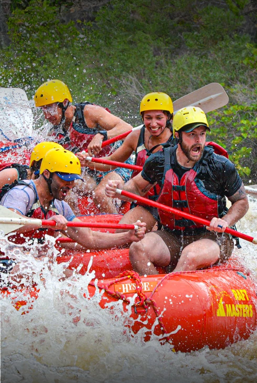 Raft Masters guests paddling through whitewater on the Arkansas River